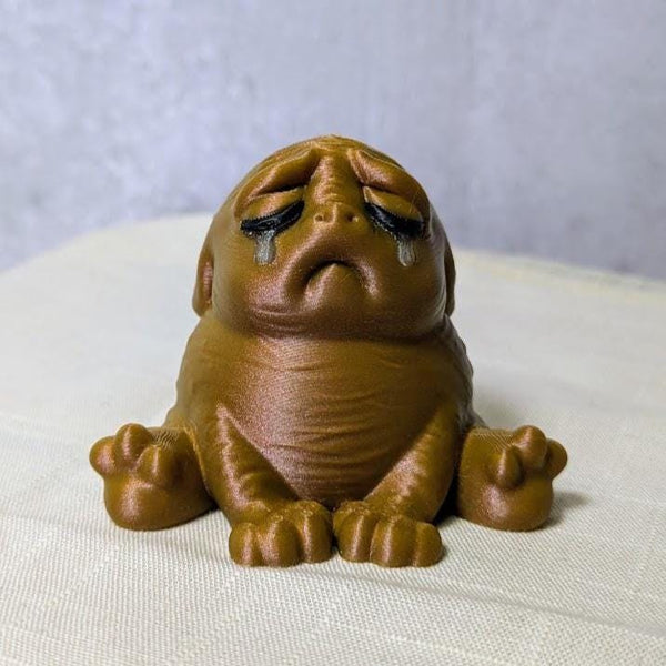 Bronze-colored Sad Potato Brown Squonk with a forlorn expression, possibly having just remembered something embarrassing from 2009.