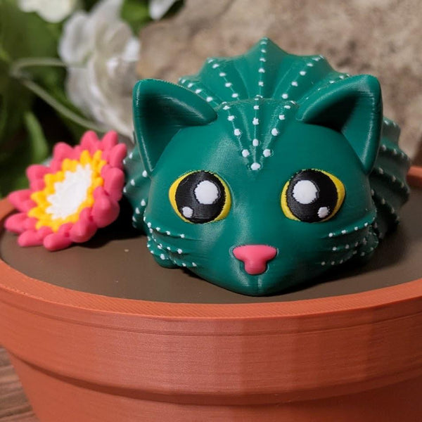 Cactus cat gazing upward with flower on side