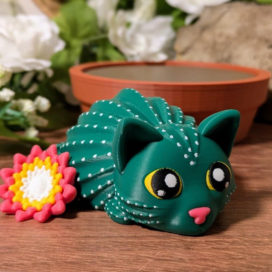 Cactus cat with dotted texture and pink flower with curious expression.