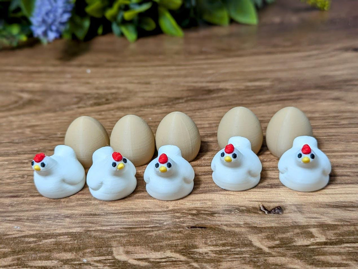 A lineup of miniature chicken and egg figurines arranged in alternating order on a wooden surface.