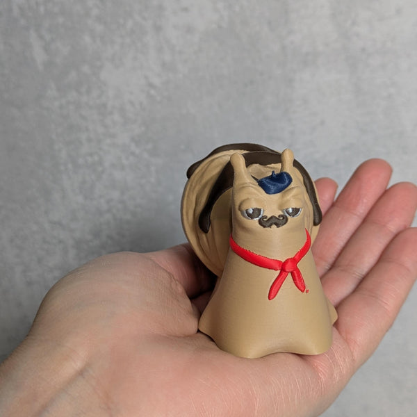 Front view of Le Escargôutier™, the croissant snail, peeking over a curled pastry shell while being held in one hand.