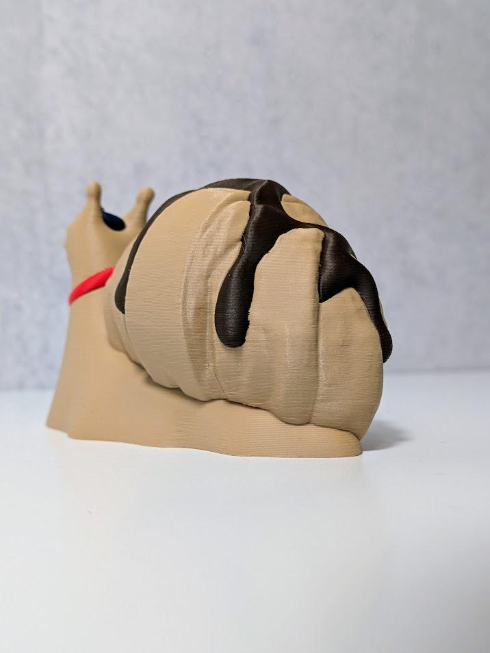 Angled view of Le Escargôutier™, showing off the chocolate-drizzled swirl of his croissant shell as he plots his next pastry heist.