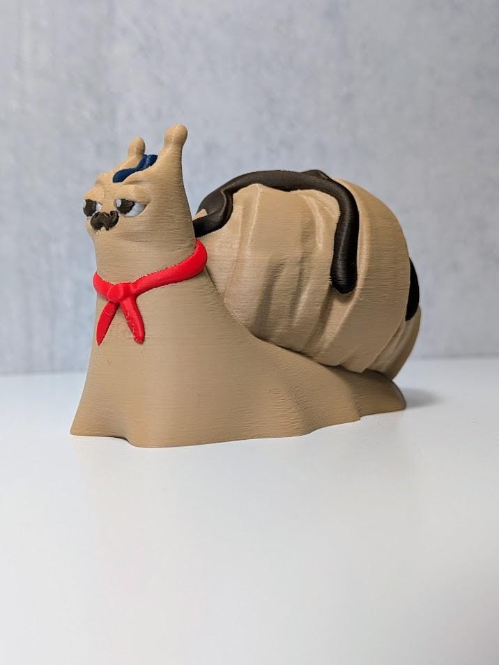 Le Escargôutier™, a croissant snail with a mustache and red neckerchief, gazes smugly to the side with his flaky shell coiled behind him.