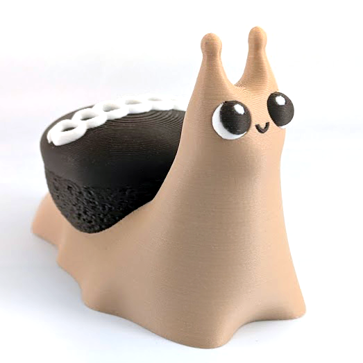 A happy little snail with a chocolate cupcake for a shell.