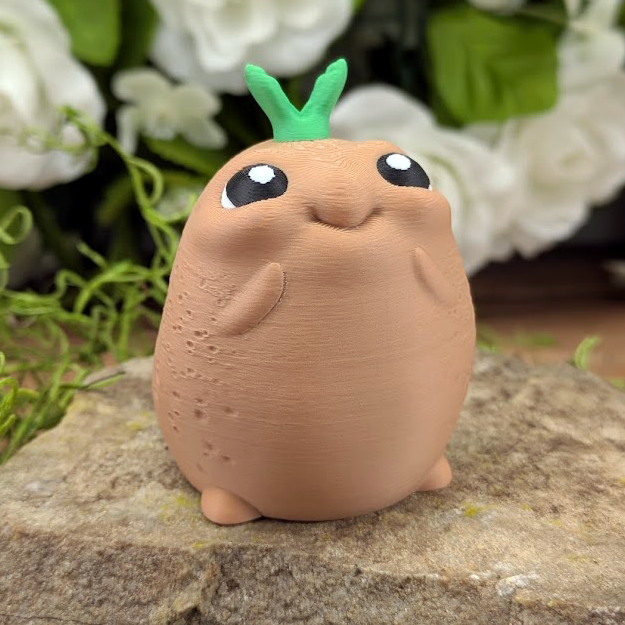 A happy potato character with big sparkling eyes and tiny arms, standing upright with a green sprout atop its head.