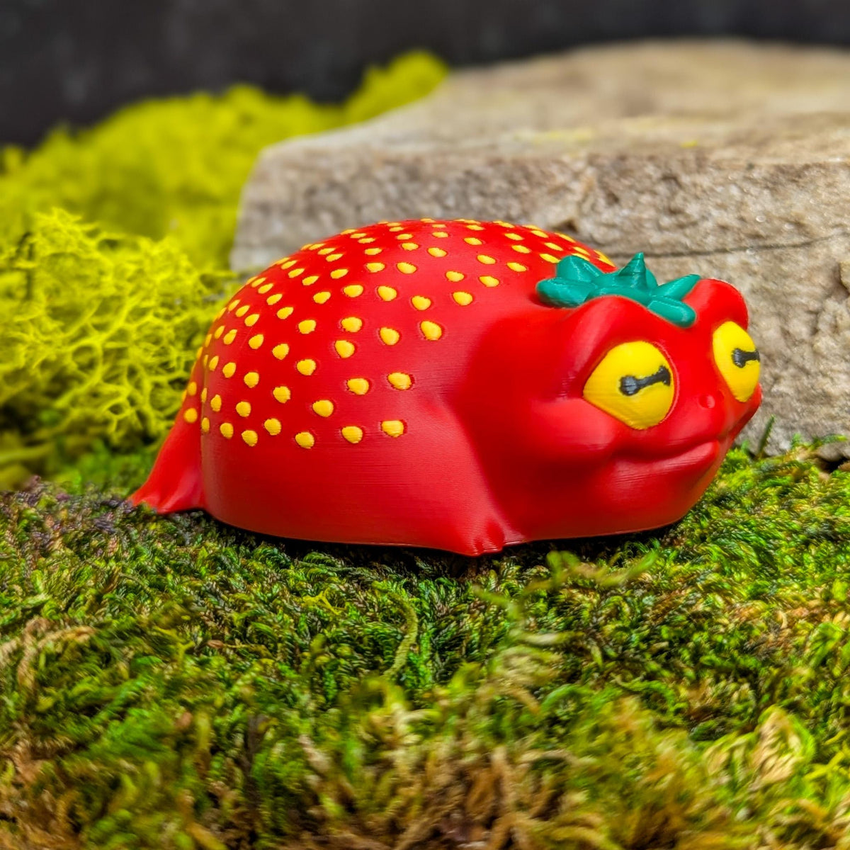 Right side of the frog figurine showing its soft curves and subtle seed texture