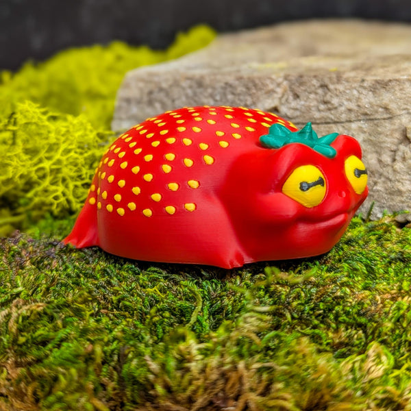 Right side of the frog figurine showing its soft curves and subtle seed texture