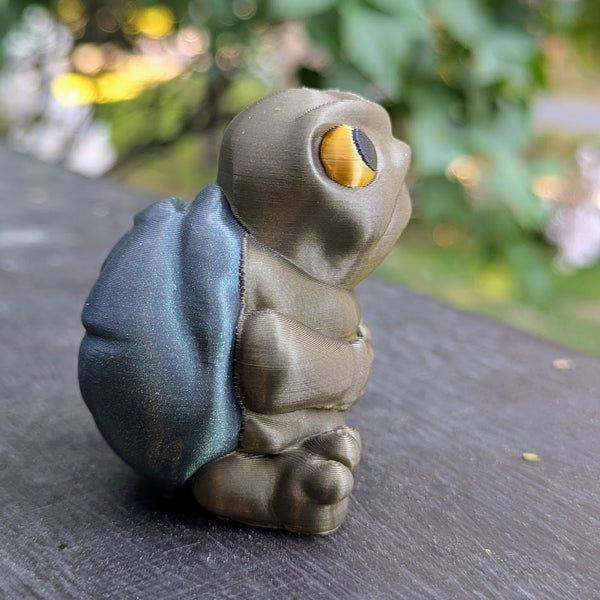 Side view of New Sculpt Judgmental Turtle™ with yellow eyes and textured shell.