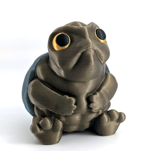 A small, very judgmental looking turtle sits on a white background. He has large yellow eyes and a grumpy frown.