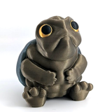 A small, very judgmental looking turtle sits on a white background. He has large yellow eyes and a grumpy frown.