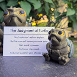Judgmental Turtle™ next to branded info card describing its design and energy.