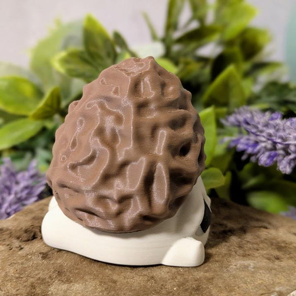 Alternate side view of mushroom figure with focus on cap texture and curved base.