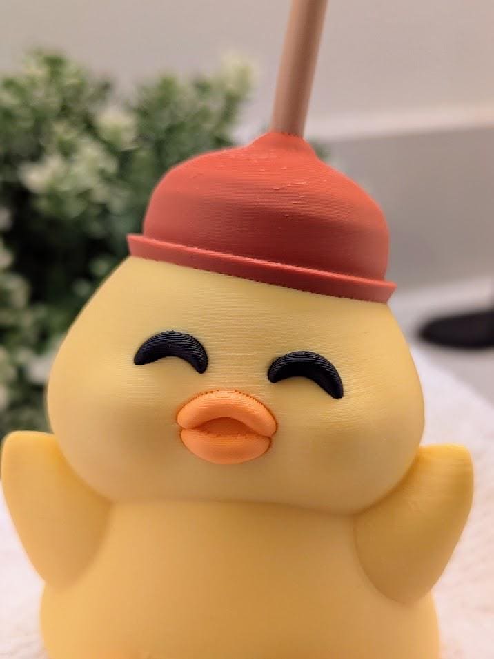 Close-up front view of smiling plunger duck with eyes shut in joy and orange beak mid-quack.