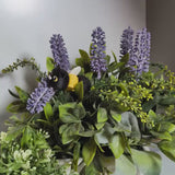 A 15-second video showcasing the Cat Bee figurine in a leafy setting, featuring a black cat with a yellow bee body and wings.