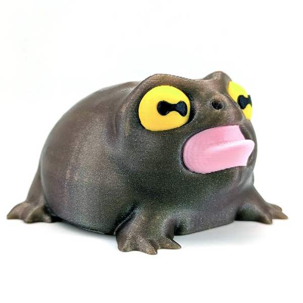 Clean product photo of the Screaming Frog against a white background, highlighting its iridescent green body, pink mouth, and cartoonish eyes.