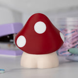 Back view of Shroomshank, a cute 3D-printed mushroom figurine with a red cap and white spots.