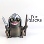 Sir Glorb, a knight frog, holds a banner that says "For Snacks!". His pink tongue sticks out, his yellow eyes are wide, and his helmet and sword are shiny silver.