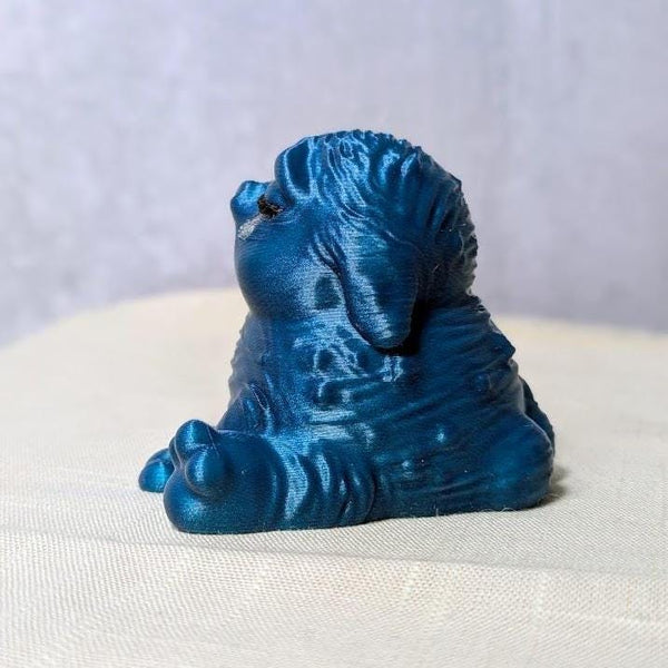 Side view of a Cerulean Sadness blue Squonk on white backdrop, shimmering with regret.