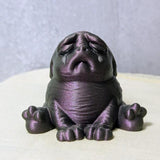 Plum Despair Purple Squonk figurine on white backdrop, quietly sobbing in gothic shades.