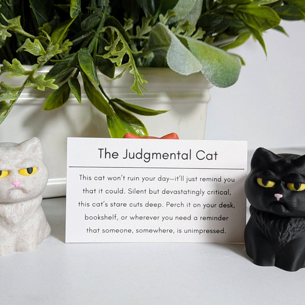 Black Judgmental Cat glares beside a card that defines its harsh personality, while other cat figures loom in the background.