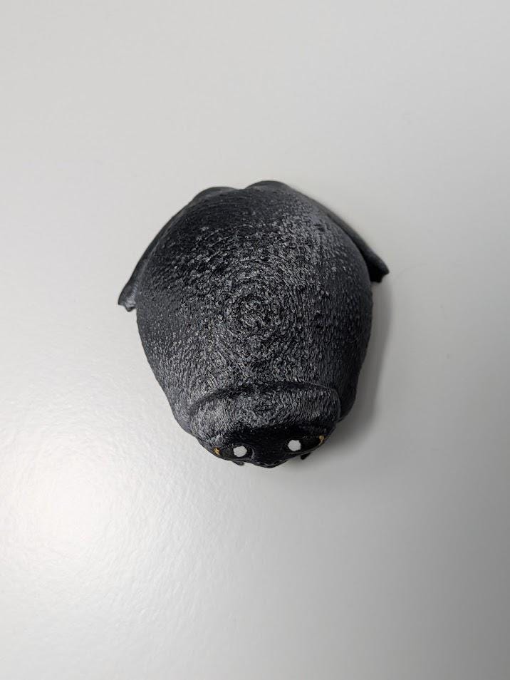 Top-down view of the Depressed Dumpling™ frog figurine, showing its slouched posture and rounded back.