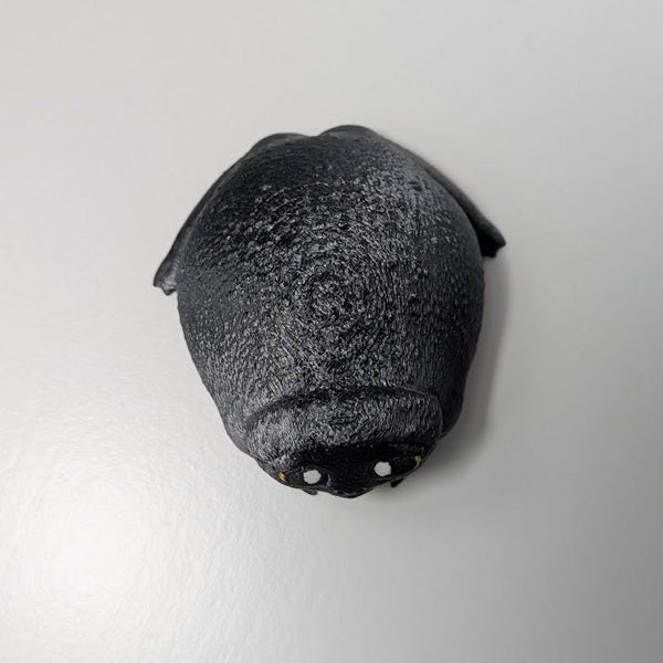 Top-down view of the Depressed Dumpling™ frog figurine, showing its slouched posture and rounded back.