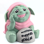 An adorable goblin in a pink cloak, with a wide toothless smile and kind eyes, sits next to a rock that says "emotional support goblin". 