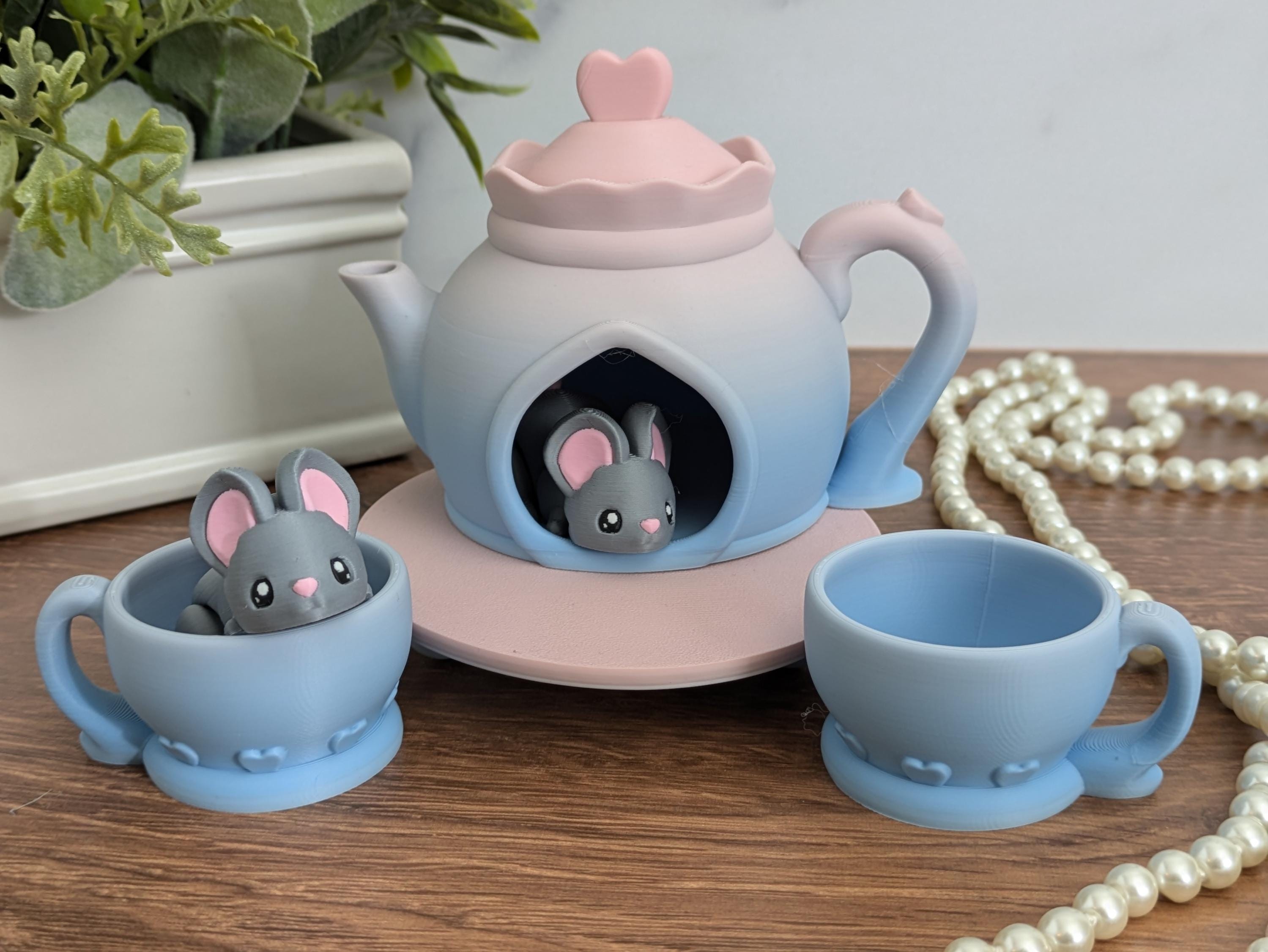 Two mice in a tea set