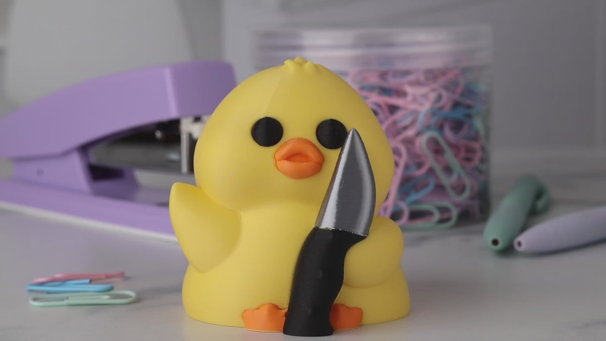 A video showing all angles of a stabby duck, a yellow duck holding a knife.