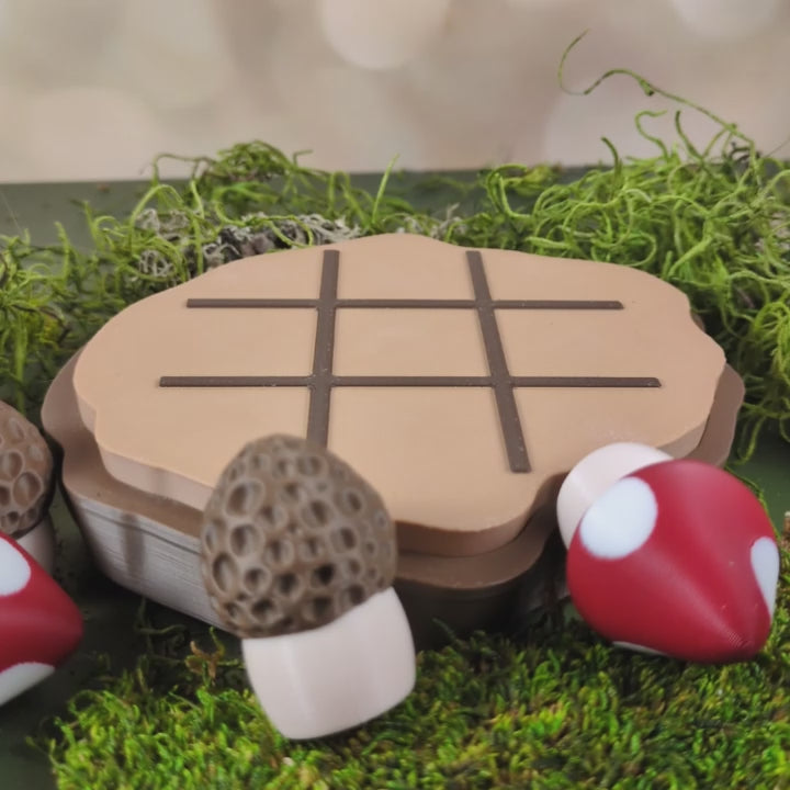 A video showing the mushroom tic tac toe board in action. You can see here that the pieces are magnetic and gently snap into place on the board.