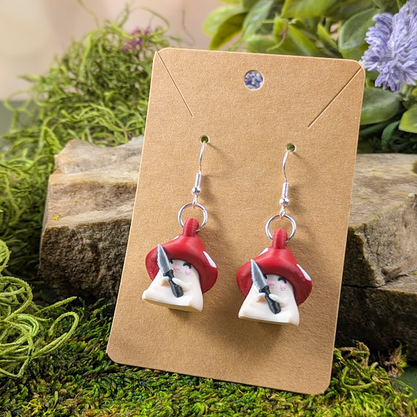 Shroomshank mushroom earrings on branded display card with rustic natural accents