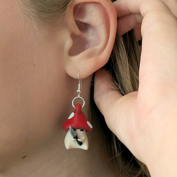 Person wearing Shroomshank mushroom earrings showing size and fit